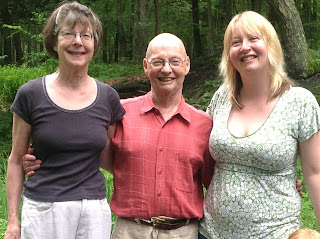 Photo of Anne Flitcraft, Evan Stark and Nancy Lombard in the woods near their home