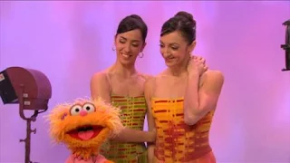 Zoe watches as Lorena and Lorna Feijóo perform their dance. Sesame Street Episode 4325 Porridge Art season 43