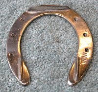 three-calk harness horse front shoe by Henry Asmus, Cornell vet school