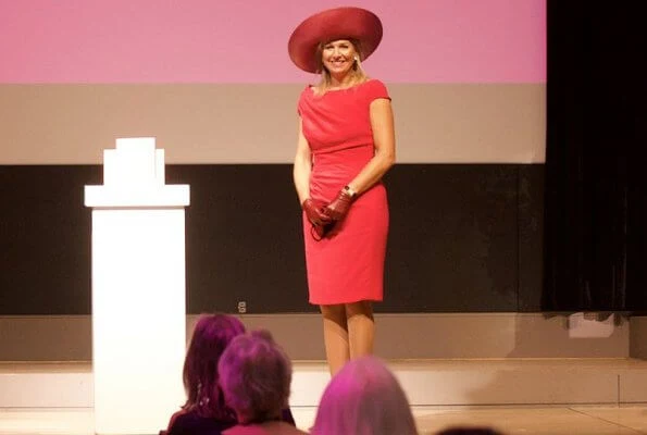 Dutch Breast Cancer Association. Queen Maxima wore a new short sleeve berry-red dress by Natan. Royal purple hat, earring Oscar de la Renta