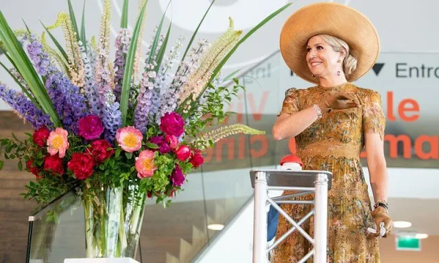 Queen Maxima wore a mustard yellow floral print dress by Zimmermann. Zimmermann Tropicale crinkle dress