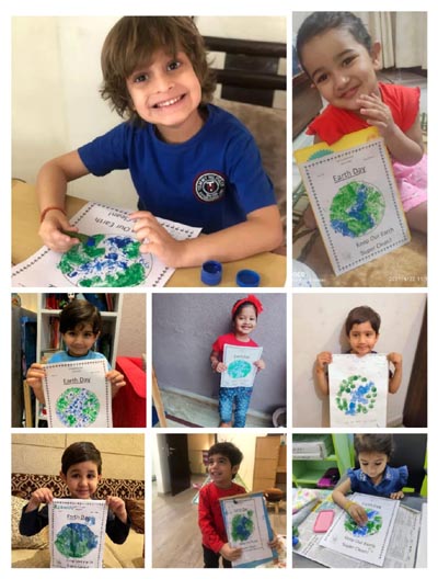 Children display poster during Earth Day Celebrations