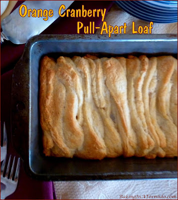 Orange Cranberry Pull-Apart Loaf, this fun treat for breakfast, brunch or a snack is full of holiday flavors.| Recipe developed by www.BakingInATornado.com | #recipe #bake