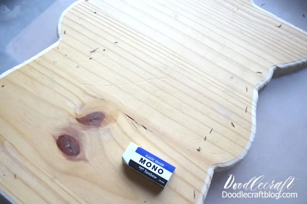 Use a Tombow MONO eraser to erase the pencil lines from the baby Yoda outlined wood cut out.