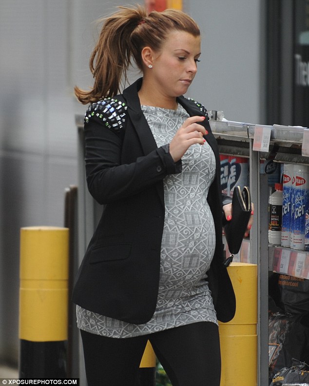 Pregnant and proud! Coleen Rooney shows off her curves during a tight