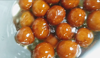 Soaked gulab jamun in sugar syrup