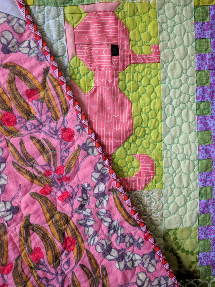 Luna Lovequilts - Back of my Plus Quilt, on the sofa