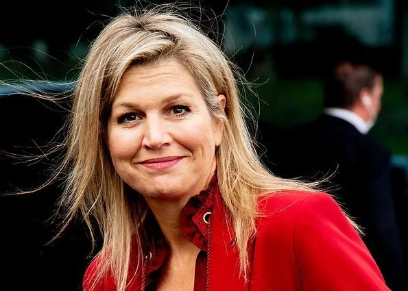 Queen Maxima wore Claes Iversen LaPerm classic blazer and Lykoi trousers and Korat silk blouse. she carries Chanel red bag