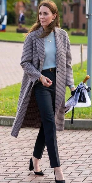 Kate Middleton wore a new handcrafted checked wool coat by Massimo Dutti, and a new cashmere crew-neck sweater by Massimo Dutti.