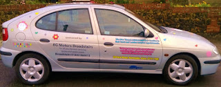 Side of car with computer cut vinyl graphics, with text hearts.