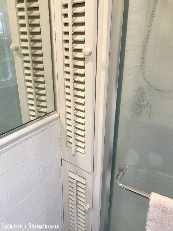 Shuttered white Cabinet Doors in the bathroom