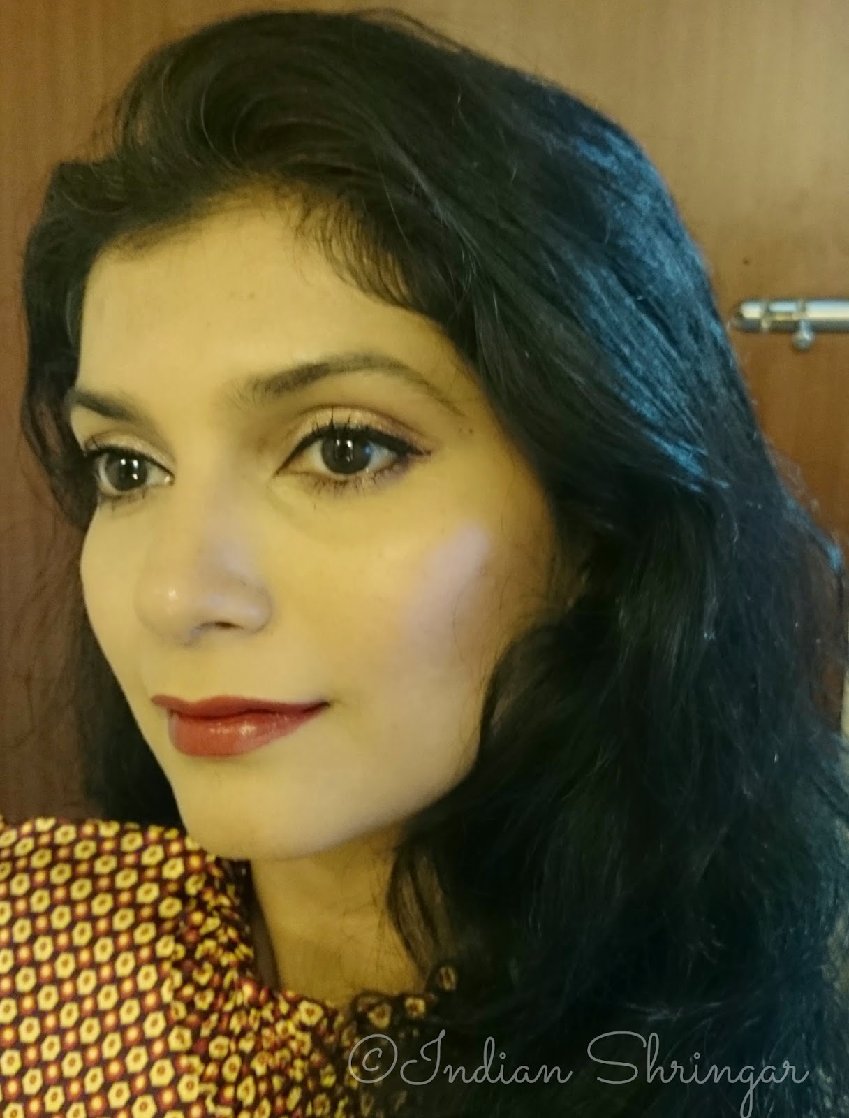 Indian Shringar's Autumn FOTD with radiant skin and dark, oxblood lips