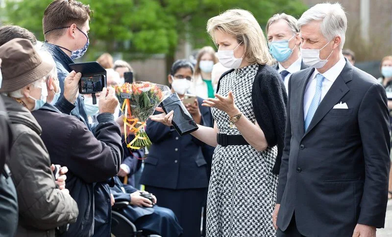 Queen Mathilde wore a new sleeveless houndstooth midi dress from CH Carolina Herrera, and houndstooth toe pumps from Carolina Herrera