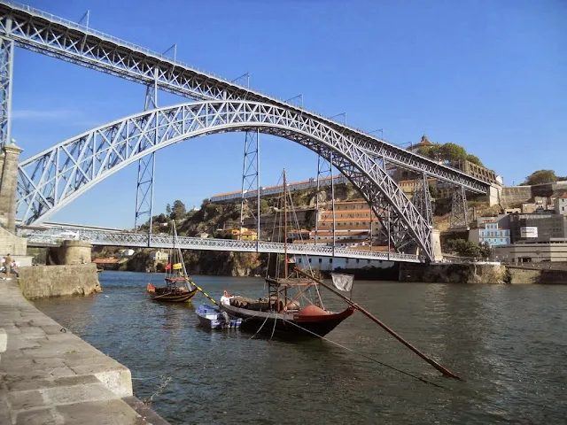 3 days in Porto - rabelo boats on the River Douro under a bridge