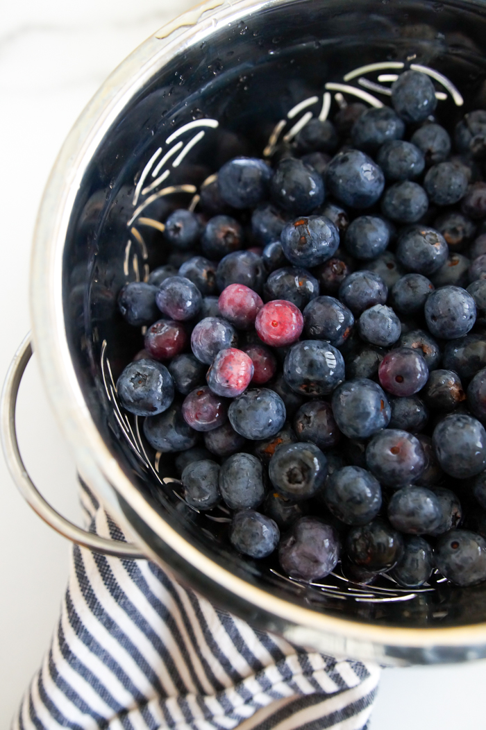 fresh blueberries in a colander