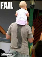 baby urinating on fathers shirt