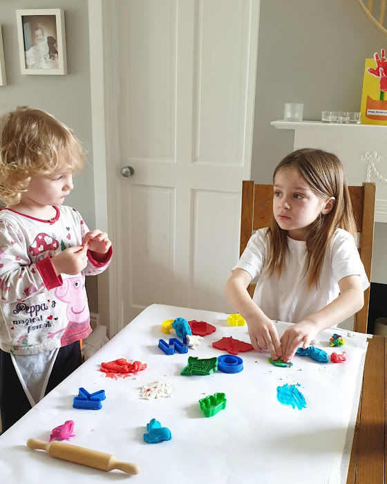 sisters playing with play doh