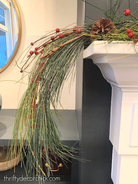 berries and garland on mantel