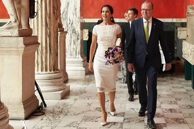 Crown Princess Mary wore a white dress by David Andersen, and snowdrop earrings by Dulong Fine Jewelry