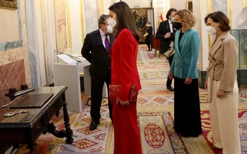 Queen Letizia wore a two-piece red suit by Spanish fashion designer Roberto Torretta