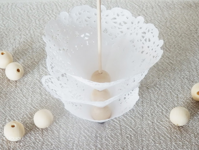 Then thread the way placemat, a wooden bead and doily.