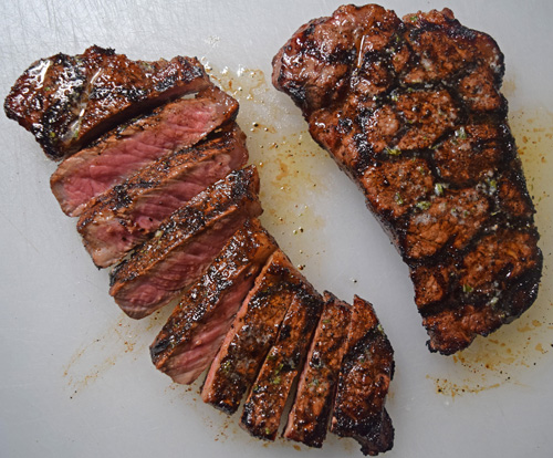 Certified Angus Beef® Brand NY Strip Steaks cooked on a Oklahoma Joe's Rider DLX pellet grill