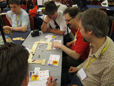 Zoom Zoom Kaboom - Andy Hopwood (the designer bottom right) demonstrating his latest game