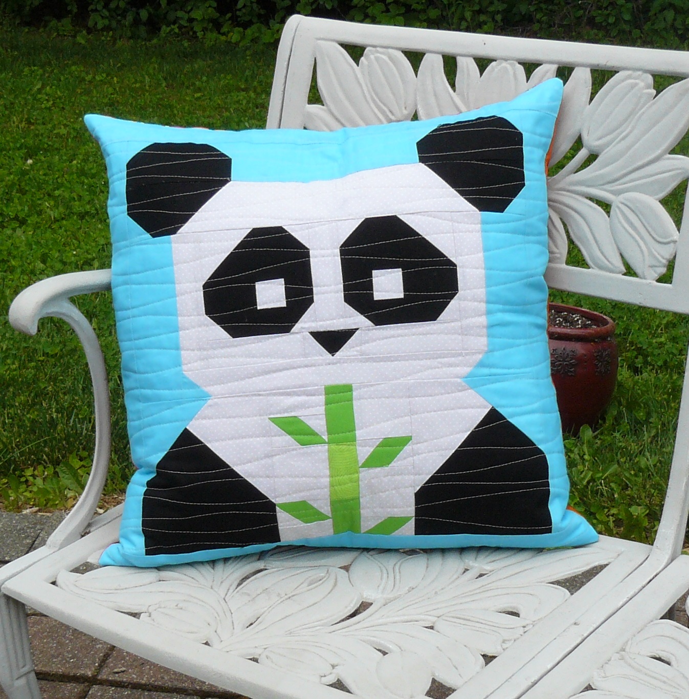 Heide's Quilty Hugs Pandamodium panda pillow.