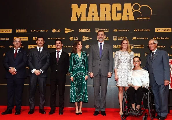 Queen Letizia wore a new scarf-print long dress by Sandro, with Prada pumps for Marca's lunch at Royal Theatre