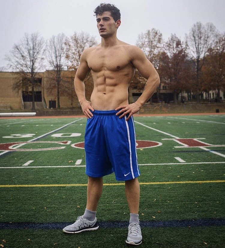 young-sexy-shirtless-jock-school-field-playing-sports-blue-shorts-dark-hair-teen-athlete-ripped-sixpack-abs