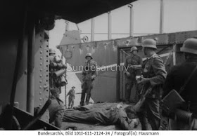 German soldiers examining a captured landing craft after the Dieppe raid worldwartwo.filminspector.com