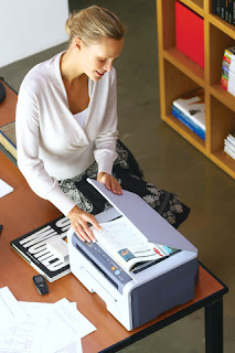 blonde woman using printer scanner