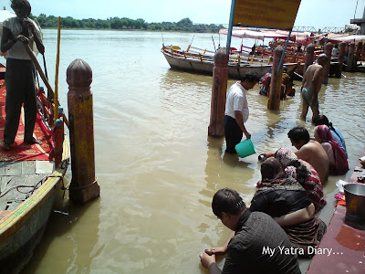 Believers doing shraddha at the Yamuna River Ghat, Mathura