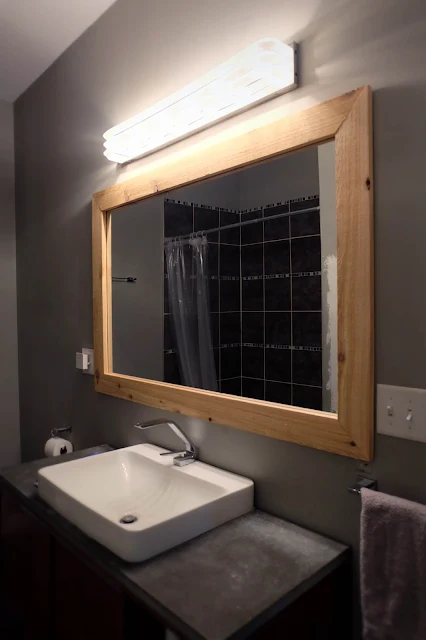 how to diy: frame a wall mounted mirror that has clips