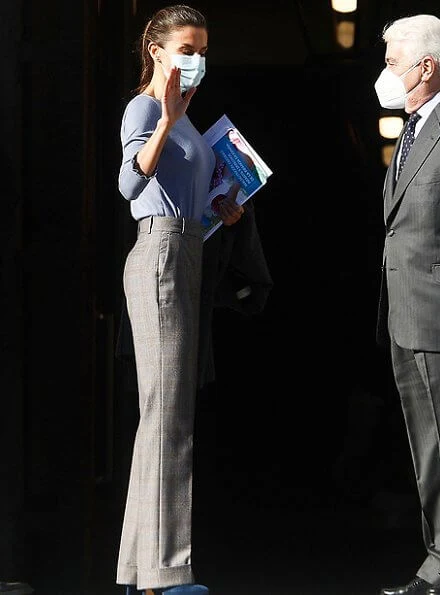 Queen Letizia wore a large plaid trousers from Massimo Dutti, and blue bell sleeve round neck ruffle cuff jersey sweater. Magrit pumps