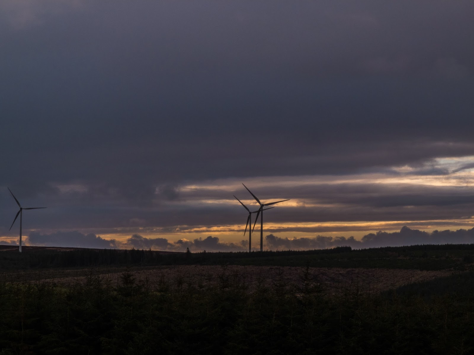 Dramatic sunset clouds and windmills in the Boggeragh Windmill Farm in North Cork.