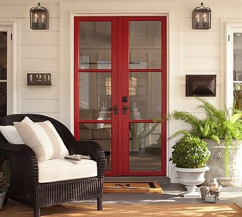 porch with brown chair and red window door