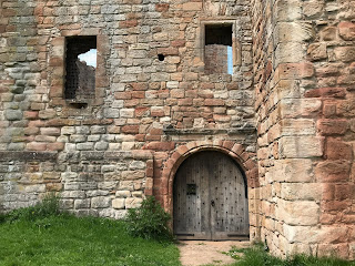 Front entrance door to Crichton Castle.  The heavy, wooden door is closed.  Photo by Kevin Nosferatu for the Skulferatu Project.