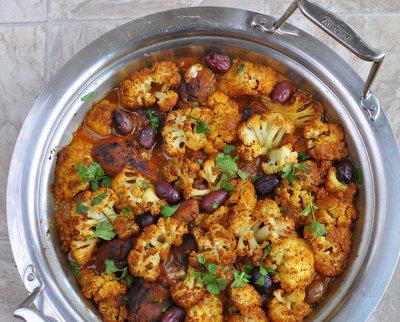 Spiced Chicken Tagine with Roasted Cauliflower ♥ KitchenParade.com, a one-pot supper, chicken and roasted cauliflower with warm spices and a touch of sour from Spiced Preserved Lemons.