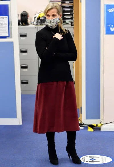 The Countess of Wessex wore a burgundy velvet skirt and a black cahmere sweater