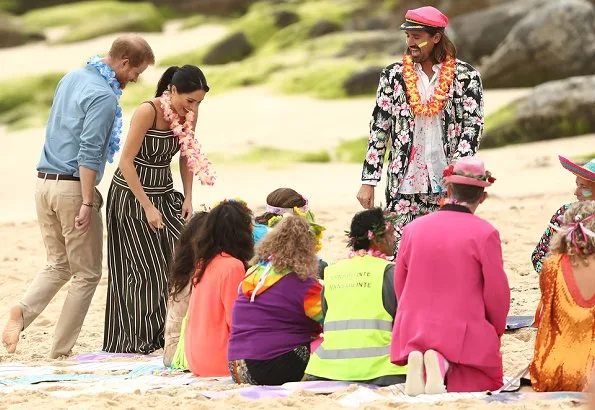 Meghan Markle wore Martin Grant Pleated Stripe Long Dress. The Duke and Duchess of Sussex visited Bondi Beach