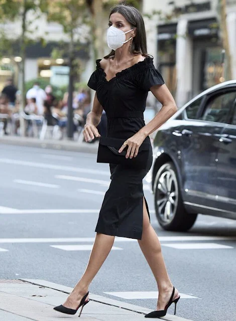 Queen Letizia wore a new Lolita black midi dress by Maria Malo. Sustainable dress. Carolina Herrera suede black pumps