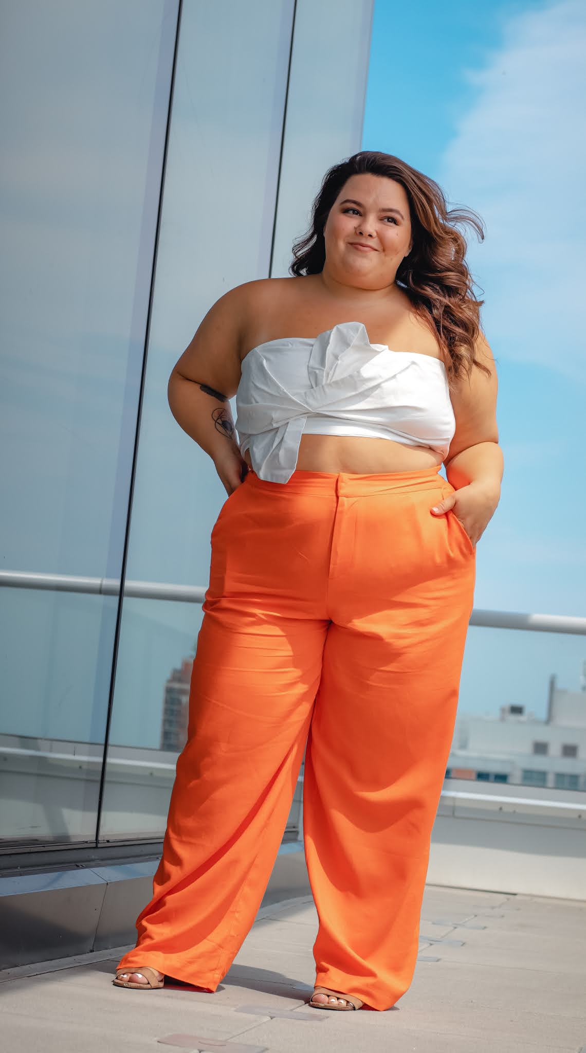 plus size and petite blogger and model Natalie in the City reviews wide leg pants she's wearing from Eloquii.