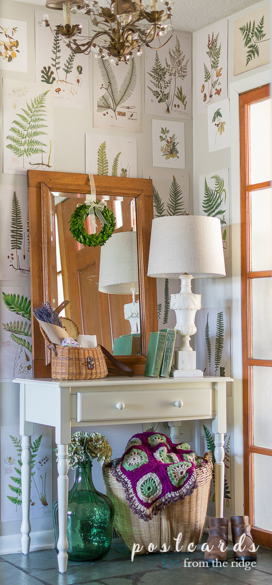 small white desk and entry decor with fern prints