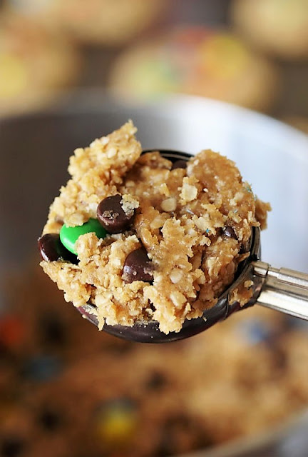 Scooping Christmas Monster Cookie Dough with Cookie Scoop Image