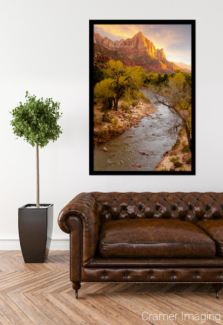 Cramer Imaging's fine art photograph "Zion's National Park" staged in a living room space with a leather couch