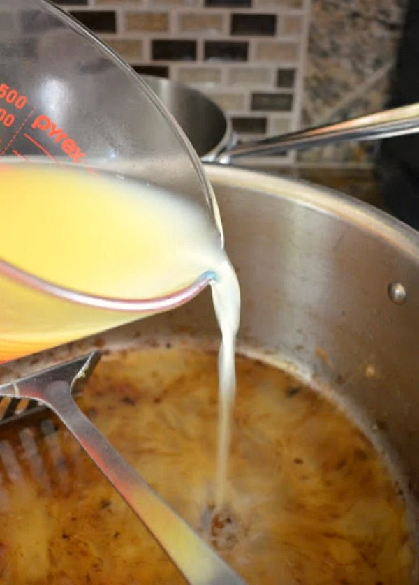 Scrape bottom of pan with white wine and chicken stock from Serena Bakes Simply From Scratch.