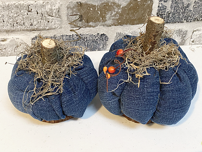 recycled denim pumpkins on wooden bases
