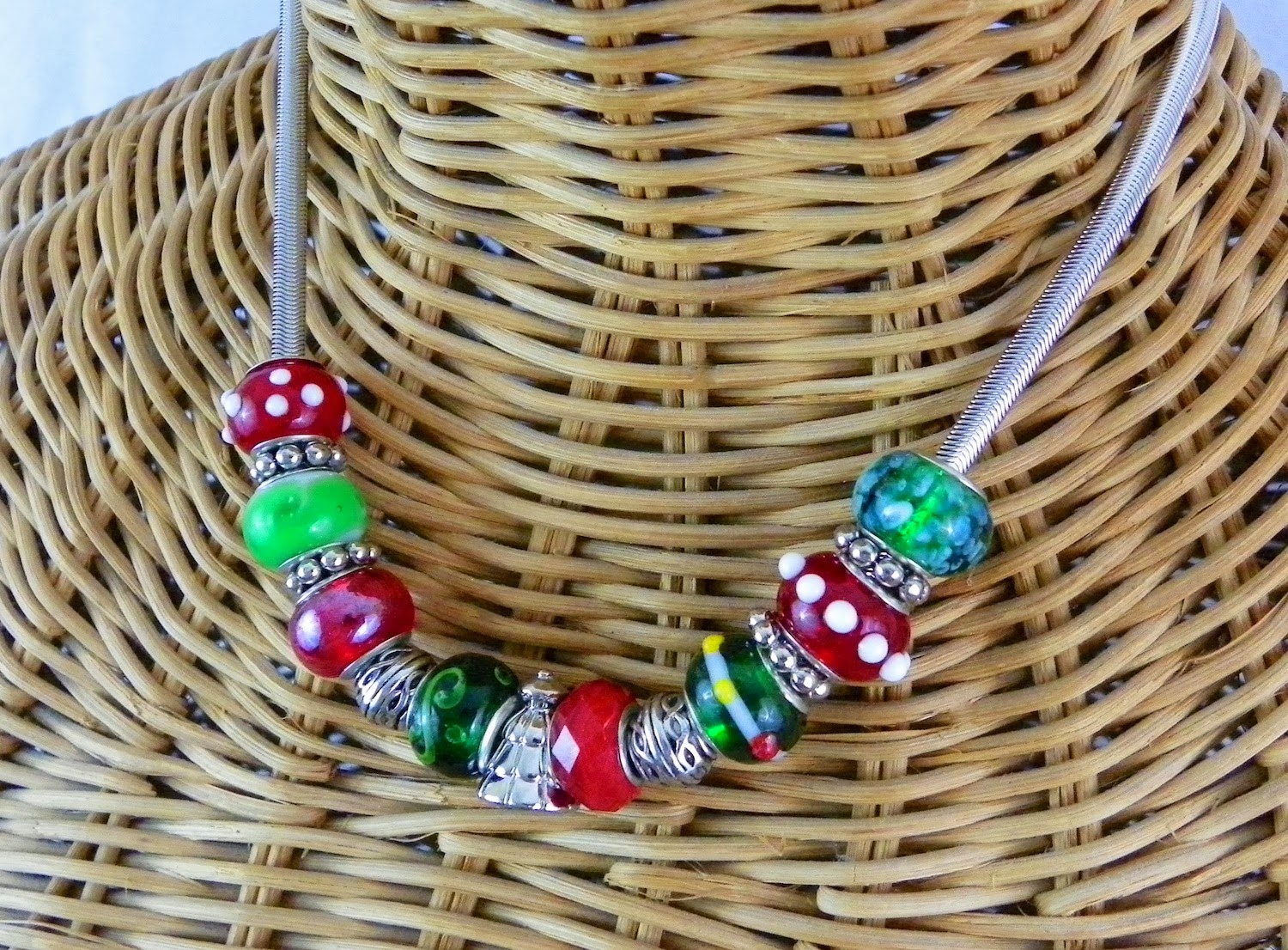 A holiday necklace with glass beads and serpentine