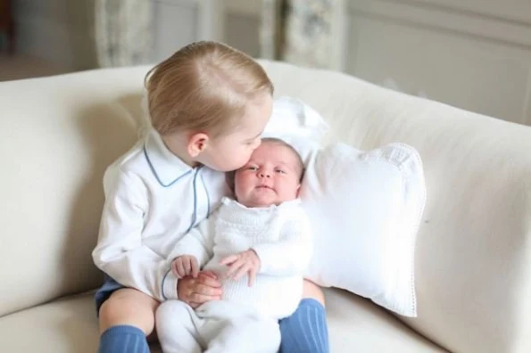 Kensington Palace on Saturday released the first official portrait of Prince George and his new sister Princess Charlotte. It was taken by Kate Middleton in mid-May. 